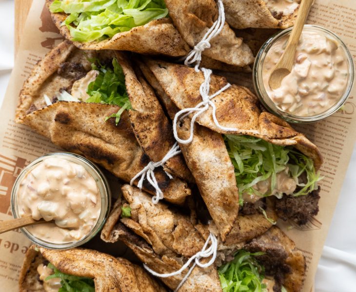 A platter of lazy smash burger wrap ready to be served to guests while hot