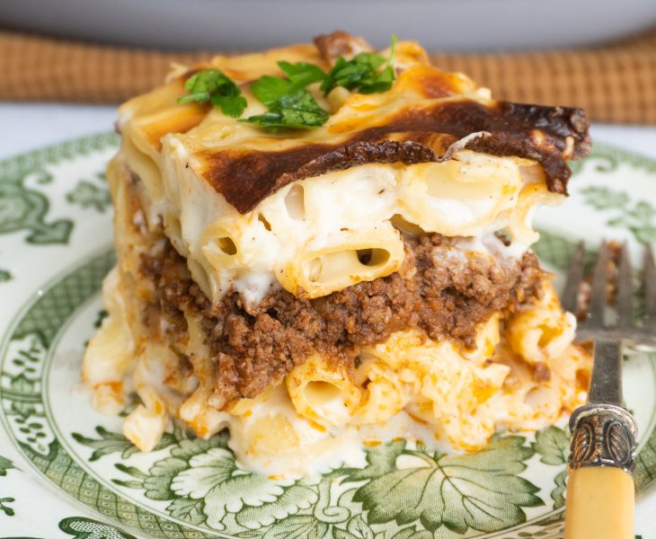 A close-up of Macarona Bechamel, showing the steamy interior. With pasta meat and sauce perfectly layered.