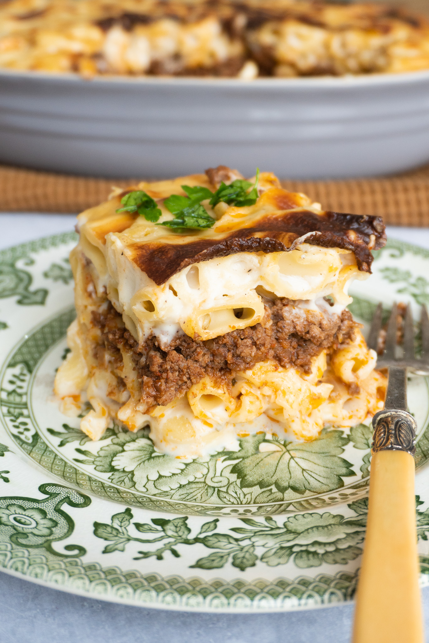 A close-up of Macarona Bechamel, showing the steamy interior. With pasta meat and sauce perfectly layered.